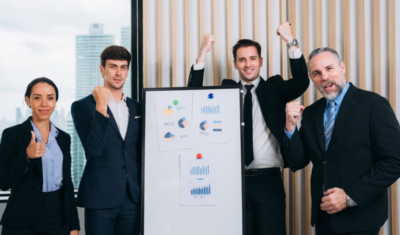 Businesspeople Professional Discussion in Modern Office. Coworkers team Collaborating on Research Strategy. Smiling group of diverse business working together.